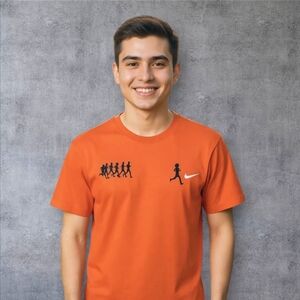 Nike Orange T-Shirt with Black Silhouette Design